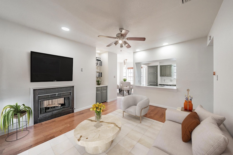 Living room with light wood-type flooring, ceiling