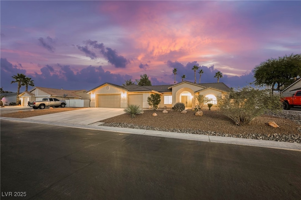 Ranch-style house with concrete driveway, a garage