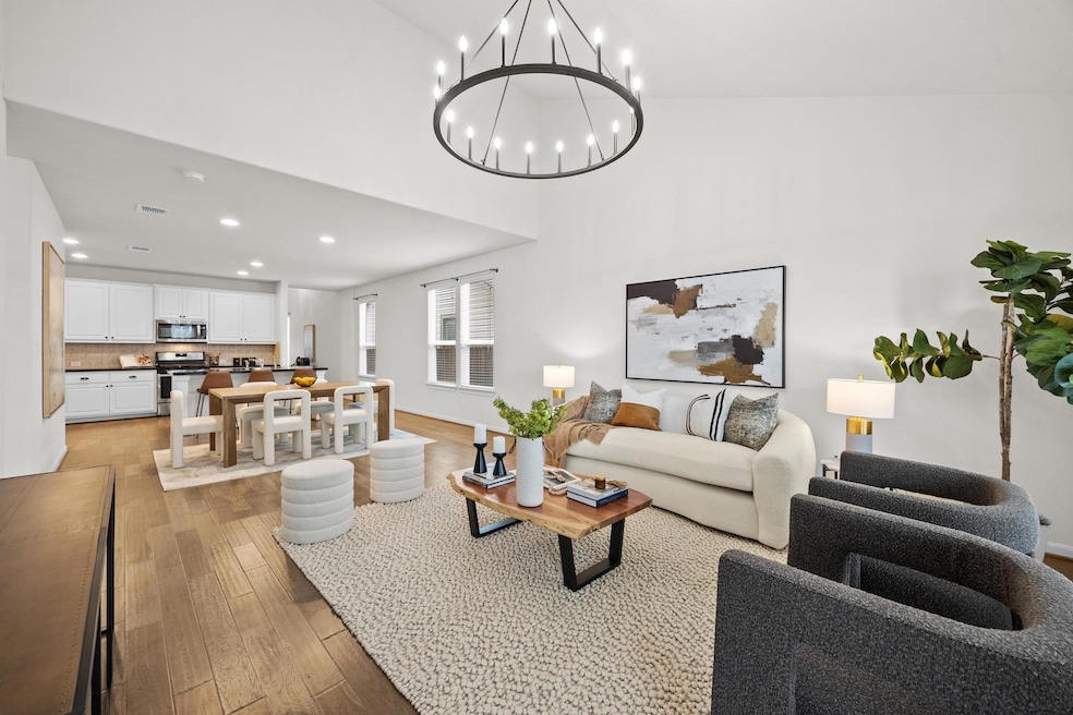 Living area with light wood-style flooring, visib