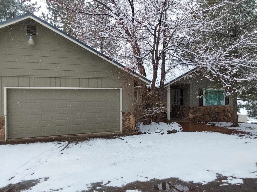 Home has quiet wooded setting in front of home