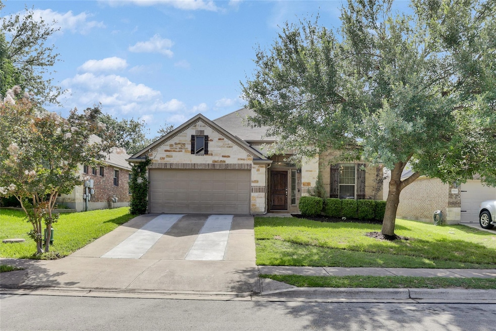 View of front facade featuring concrete driveway,