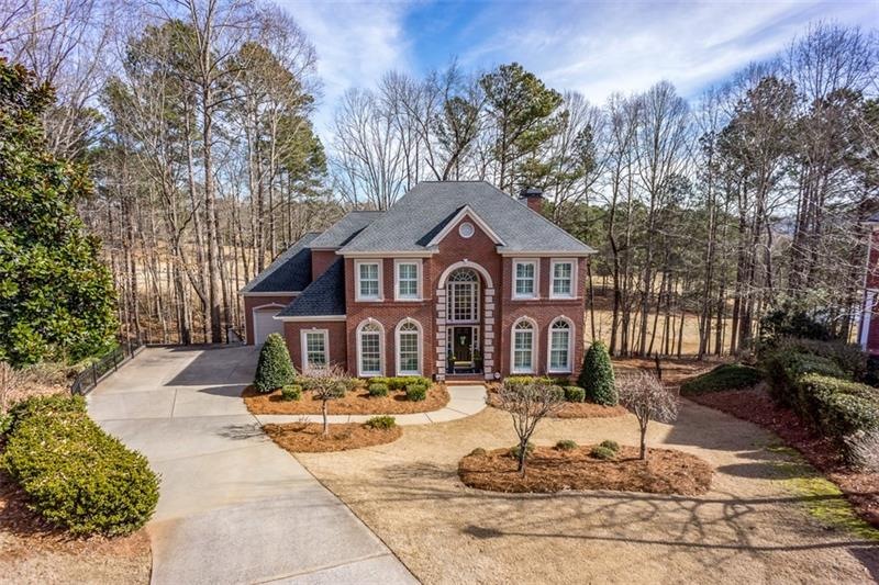 Curb appeal plus!!  Beautiful 3-side brick home on