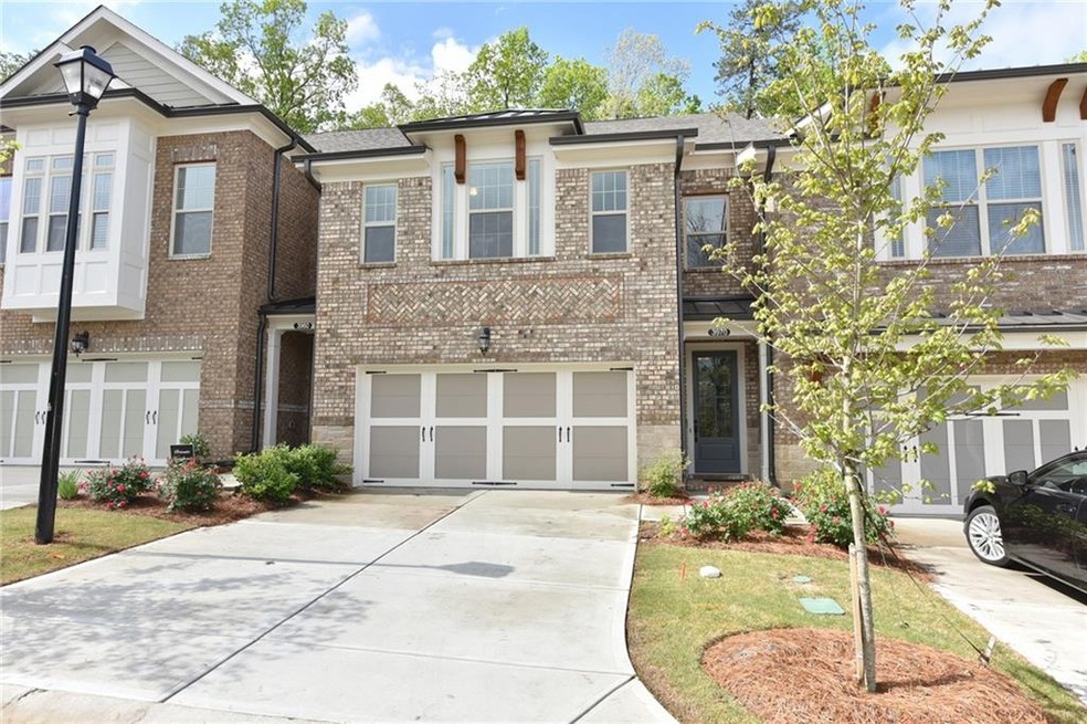 Brick front townhome with additional driveway park