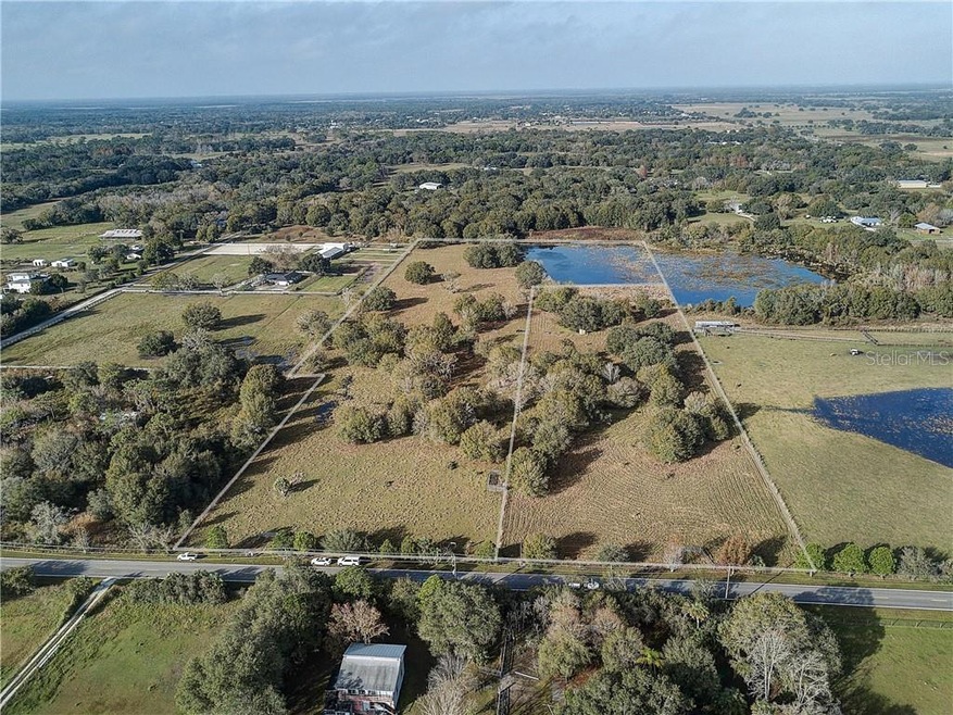 10 acres on left side and wraps around back of the