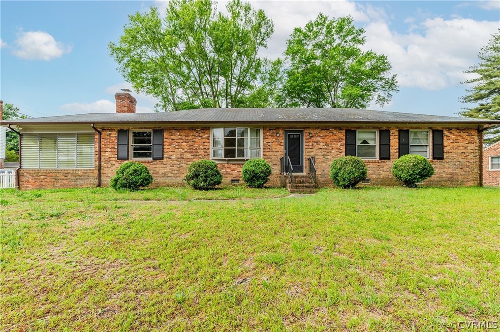 Ranch-style home with a front lawn
