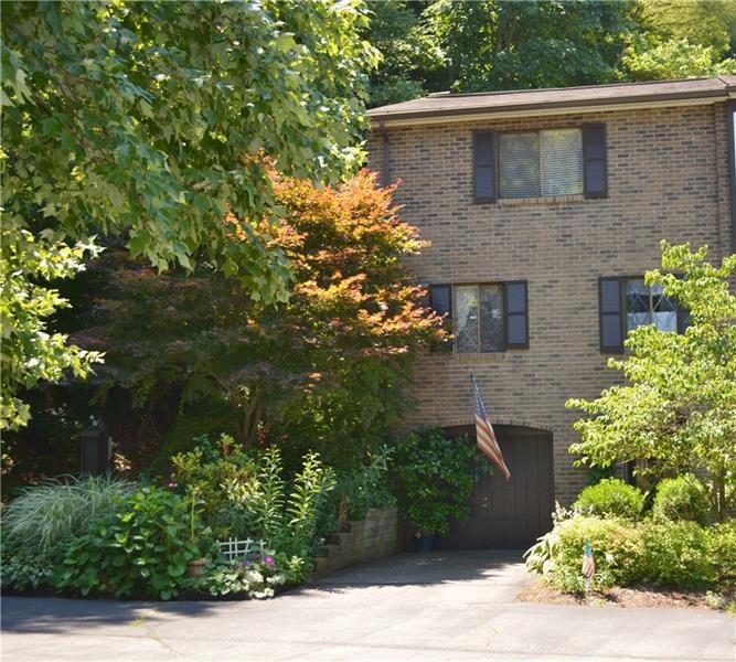 Beautifully landscaped all brick end unit in Newto