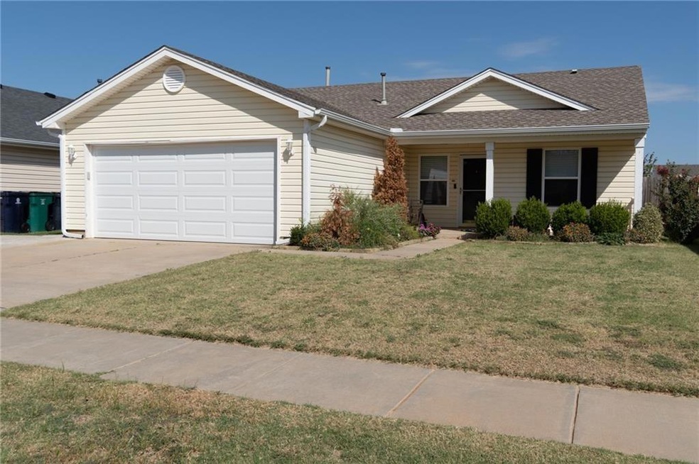 Single story home featuring a garage and a front l