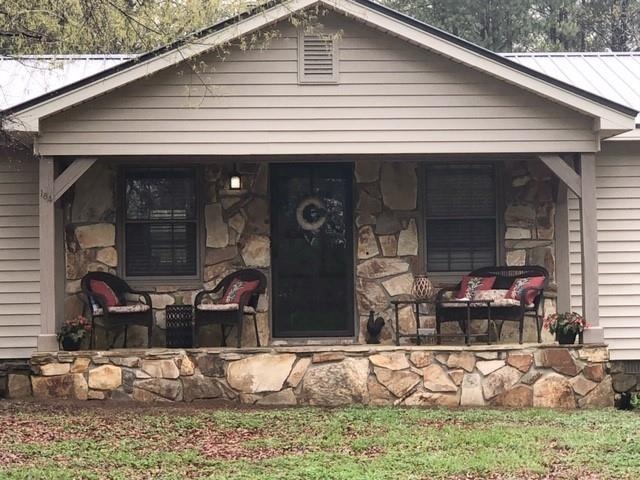 Beautiful front porch and stone entrance.