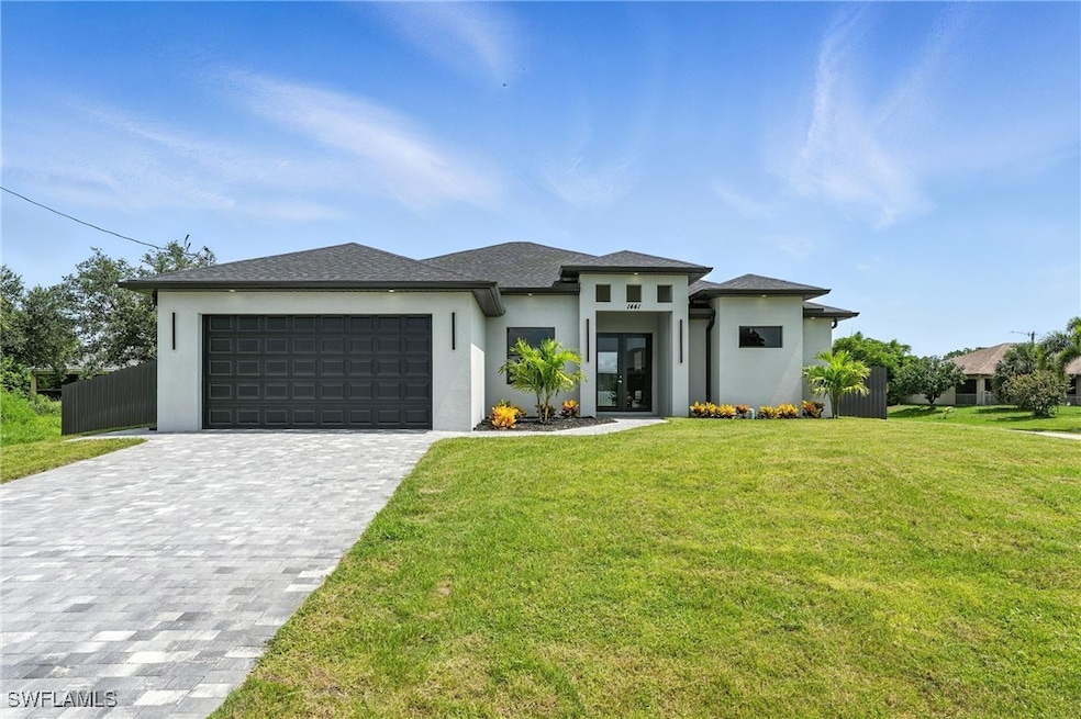Prairie-style house featuring stucco siding, an at