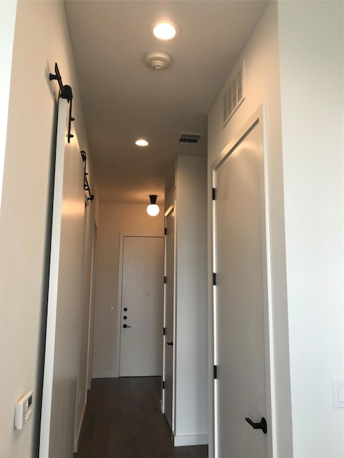 Corridor featuring recessed lighting and baseboar