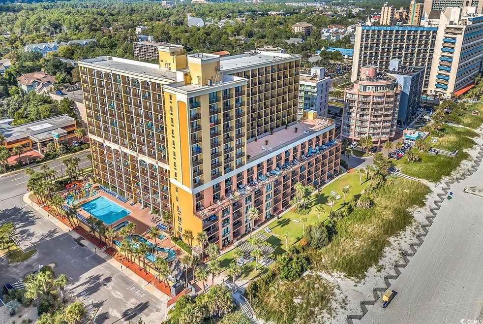 View of urban area with a pool area and apartment complex / building