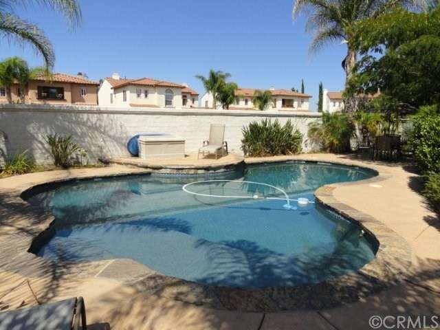Pool view from just inside rod iron gate.