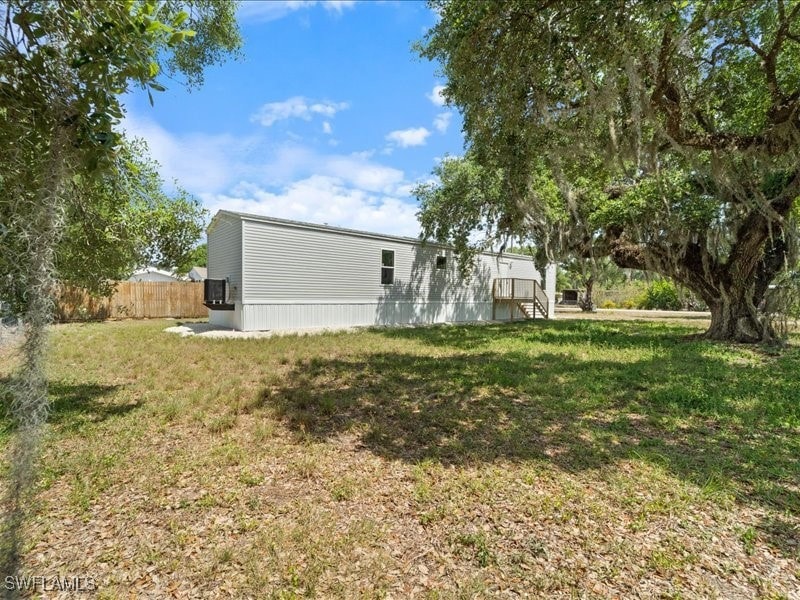 View of yard featuring fence