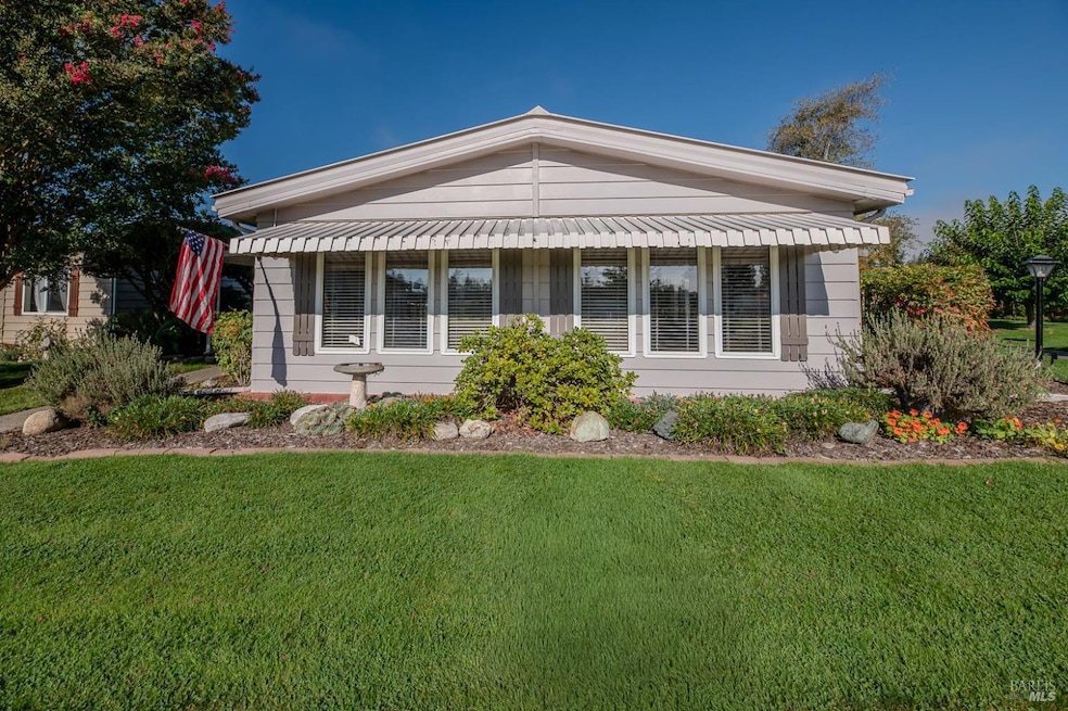 Front of home overlooks the greenbelt, pool and clubhouse