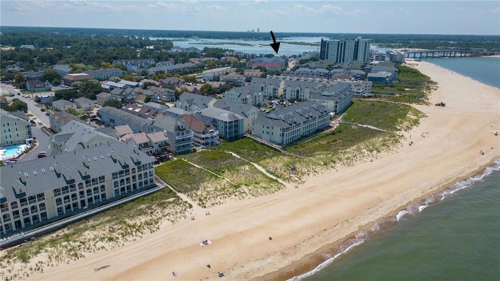 Spacious condo with one-level living, elevator, and covered parking. Arrow shows distance to the bay!