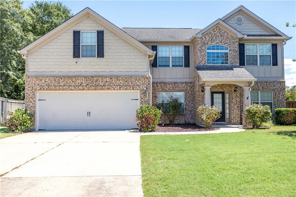View of front of home featuring a garage and a fro
