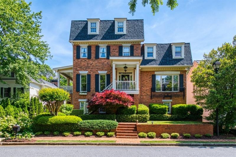 This gorgeous Charleston-style 4-sided brick home 