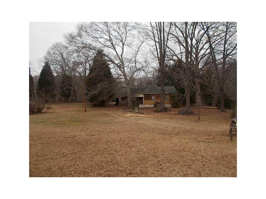 Exterior Front. Flat terrain great for new home or