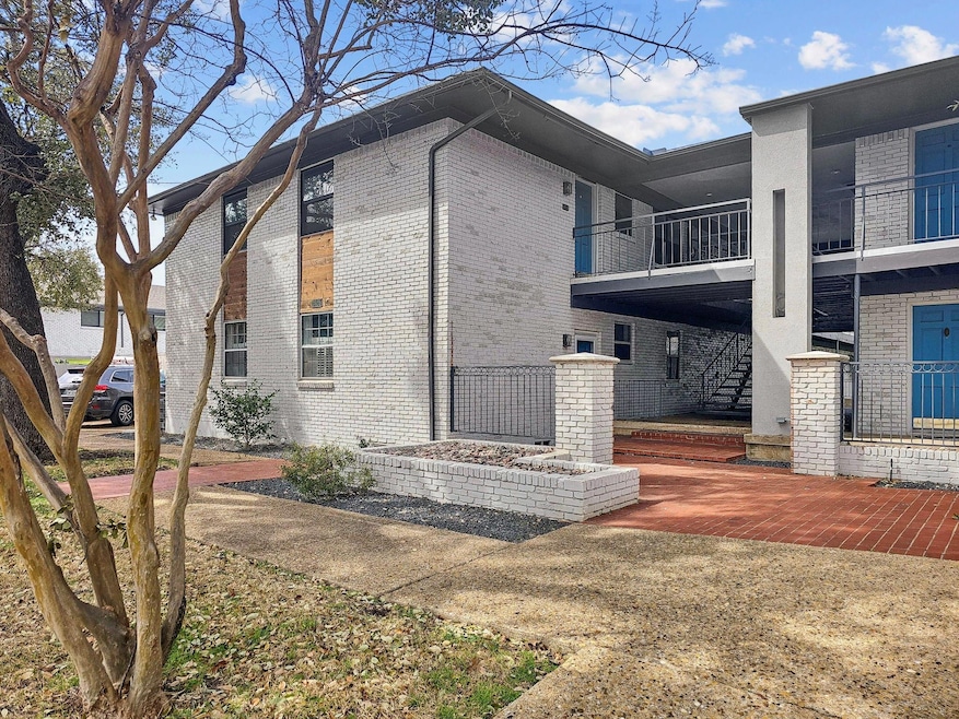 View of side of home with brick siding