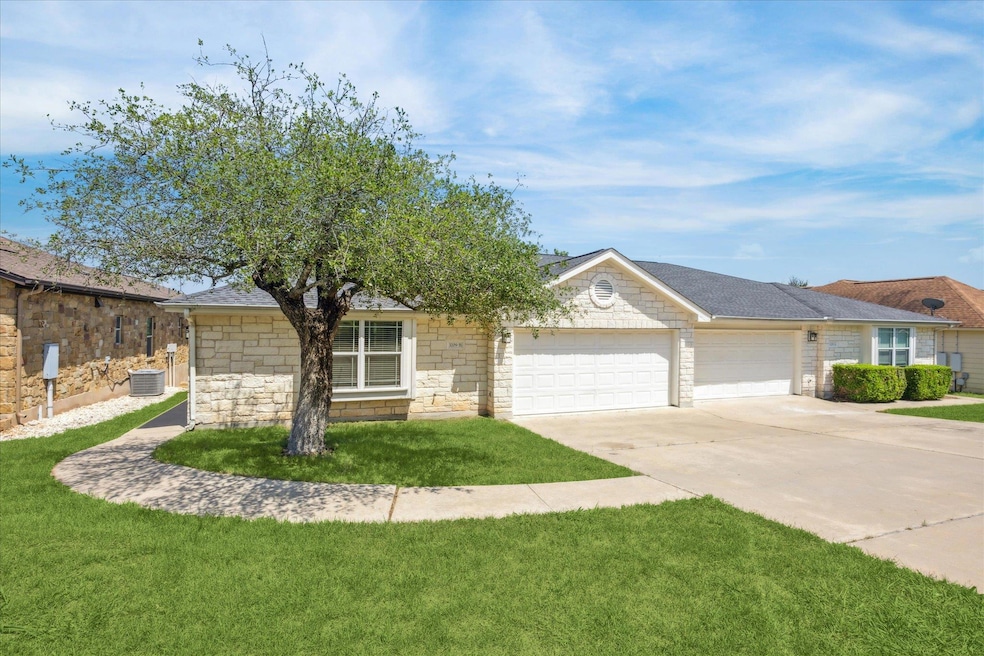 View of front of home with an attached garage, dr