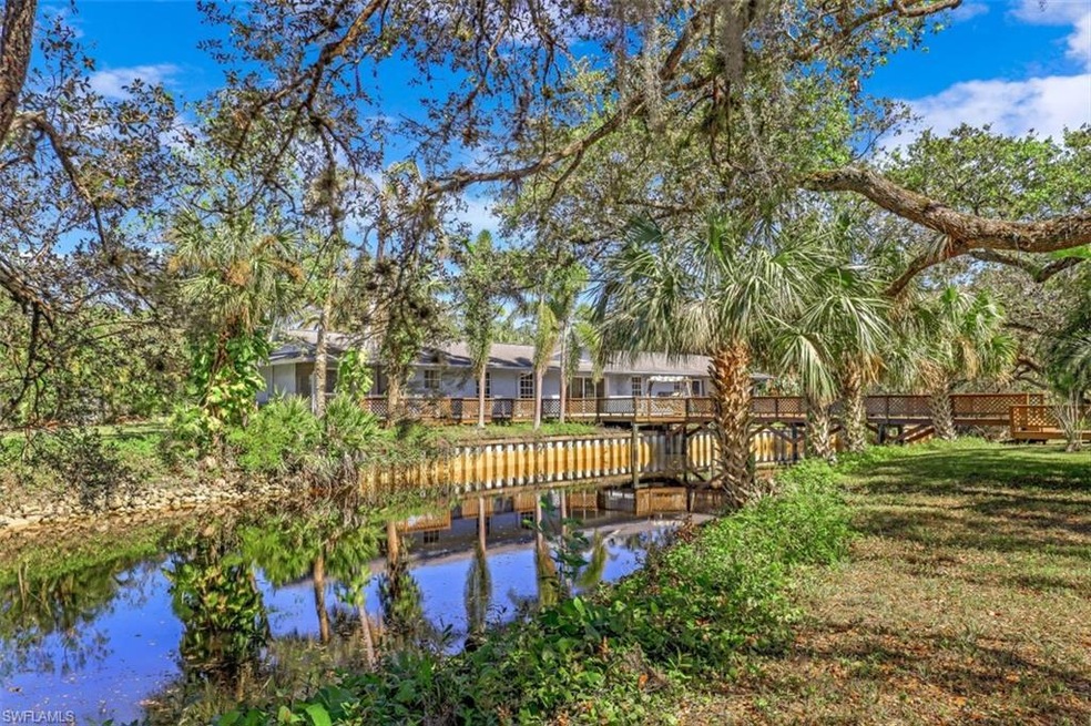 View of home and river inlet from the backyard.
