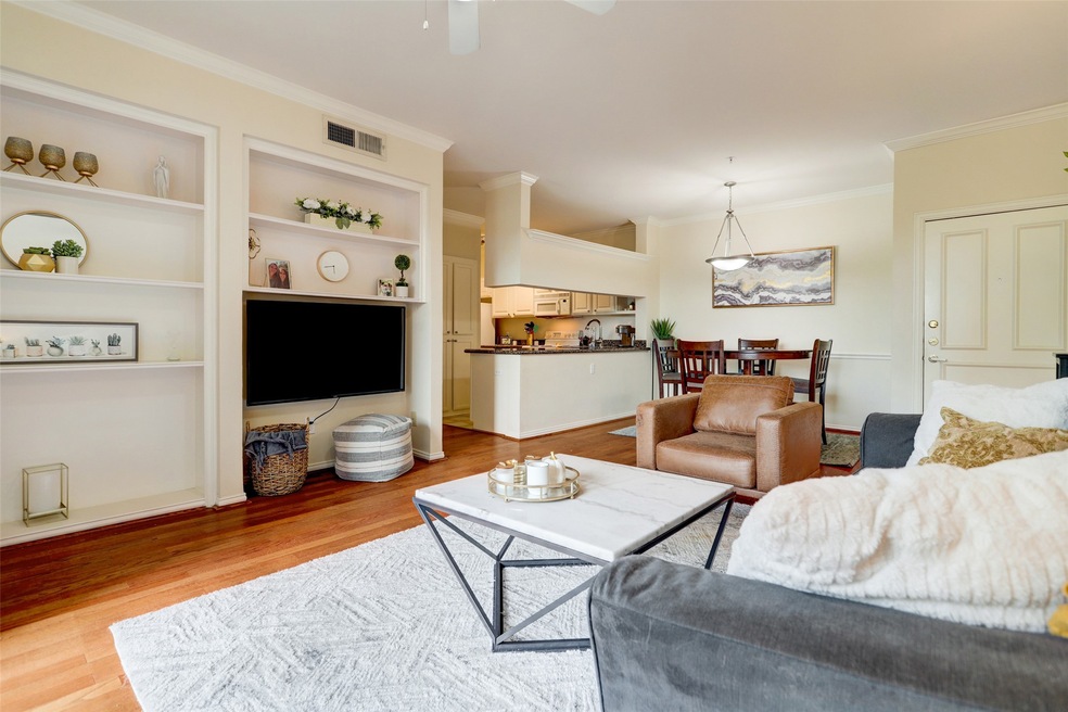 Living room has an abundance of sun and is an open floor plan.