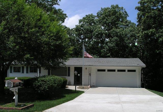Great curb appeal and nice driveway.
