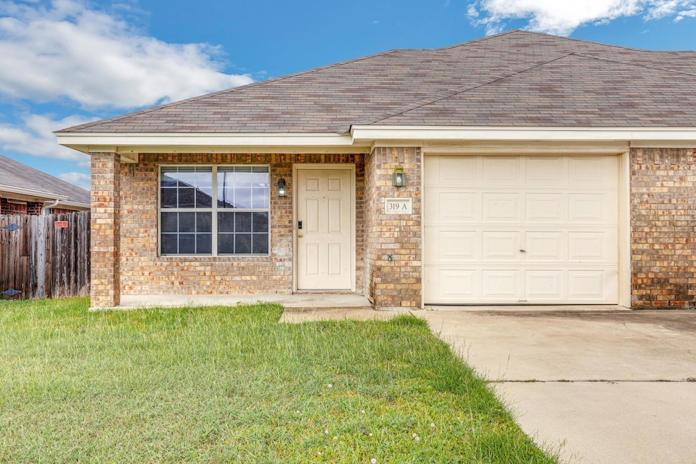 View of front of property featuring brick siding,