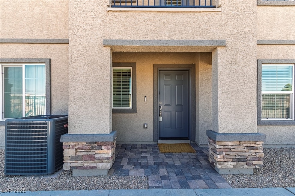 Entrance to property with stucco siding