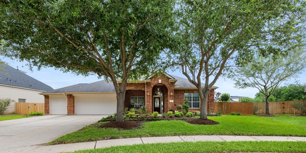 Stately single-story home on an oversized lot with a 3 car garage.