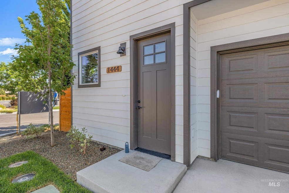 Doorway to property featuring a garage