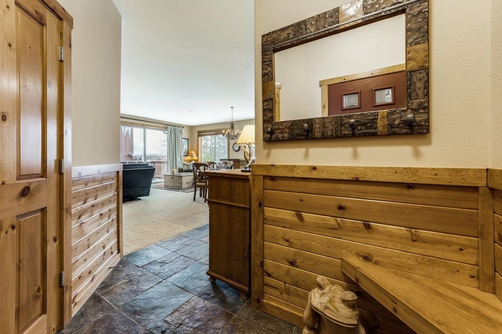 Entryway with pine bench and coat closet with slat