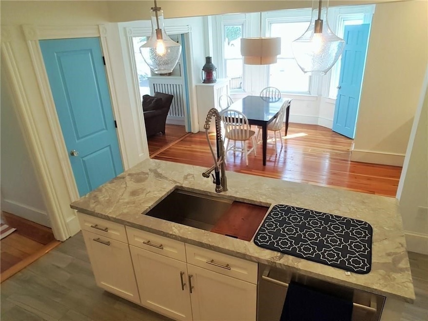 Open kitchen/dining with neutral color palette