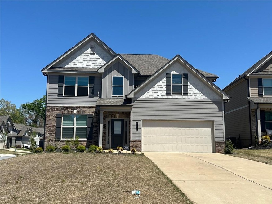 Craftsman-style home featuring a garage and a fron