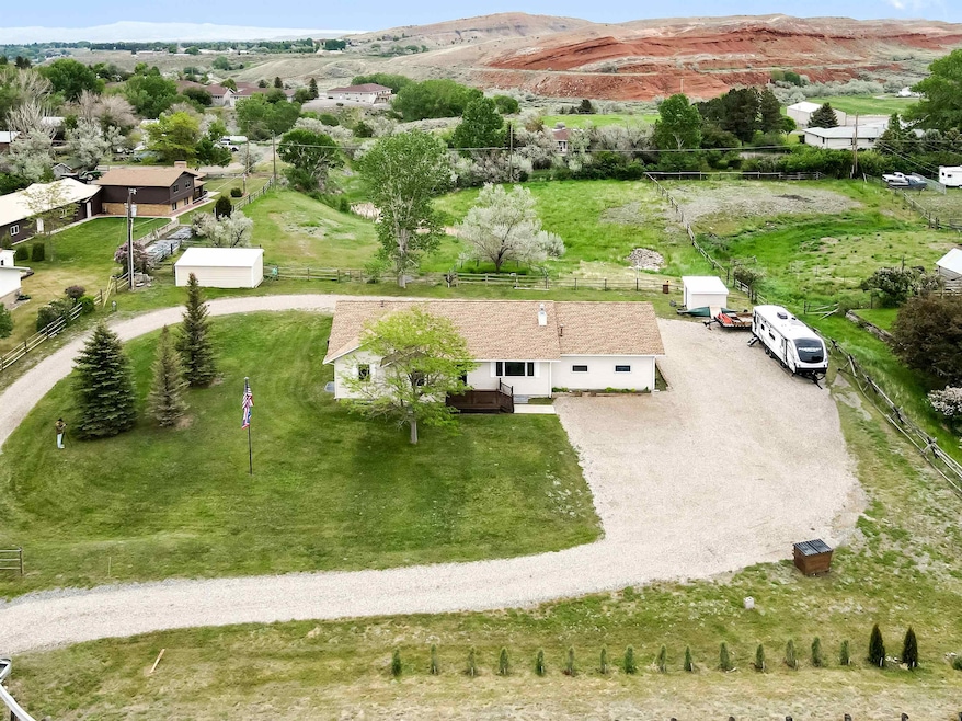loop driveway and pasture behind the home