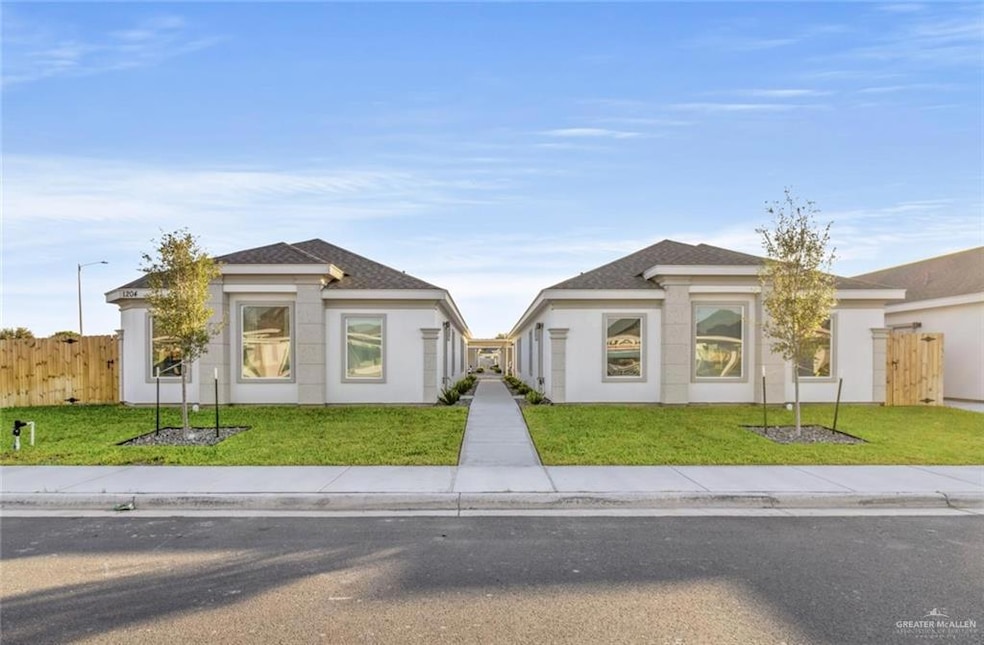 View of front of home with stucco siding