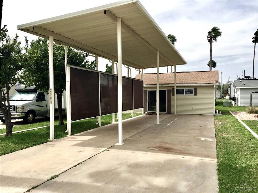 View of car parking with a lawn