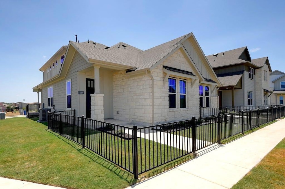 View of front of property featuring stone siding,