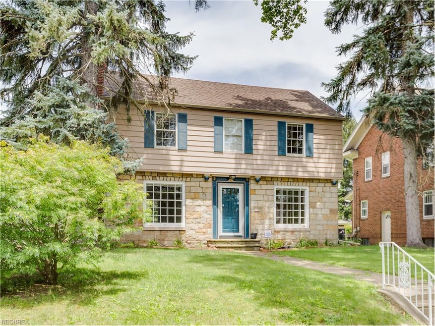 This darling Colonial-style home has beautiful san