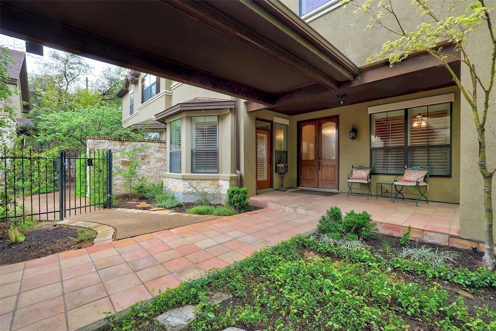 View of exterior entry featuring stucco siding, c