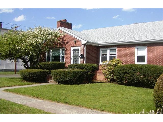 Walk to the beach from this custom built  brick ra