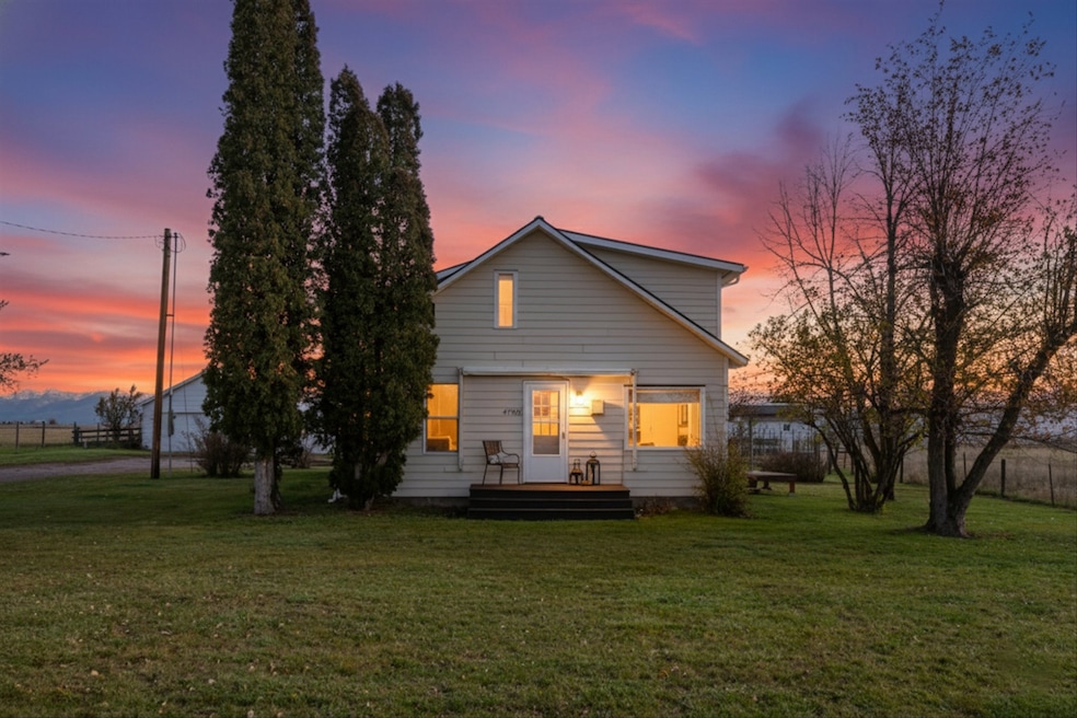 View of back of house at dusk