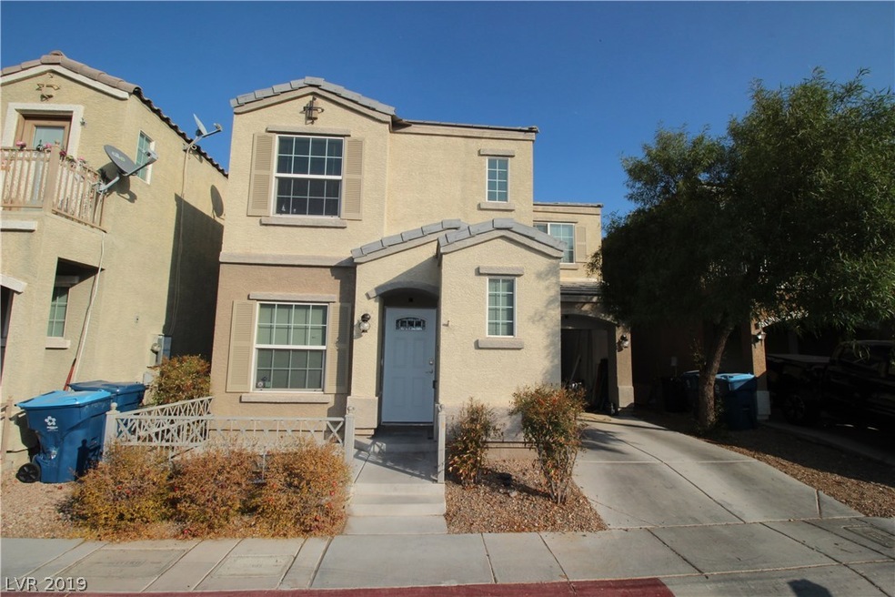 House faces West, front porch and driveway