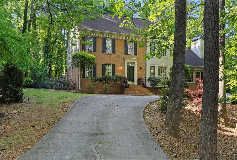 Circular drive leads to this traditional colonial 