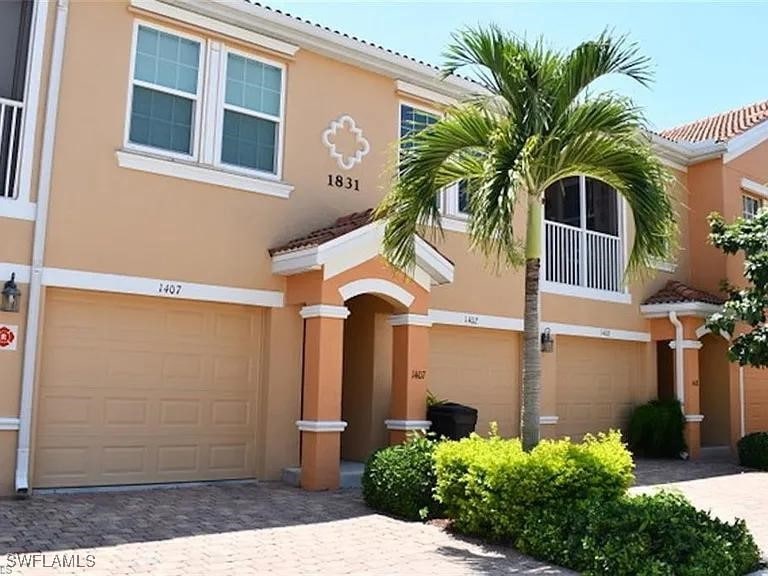 View of front of property featuring an attached ga