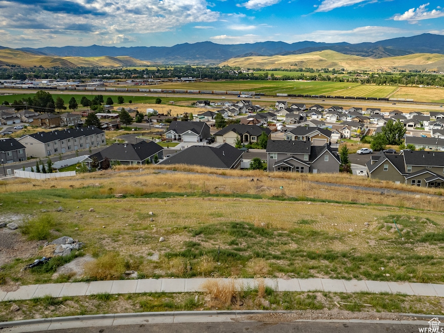 Property view of mountains featuring a residential view