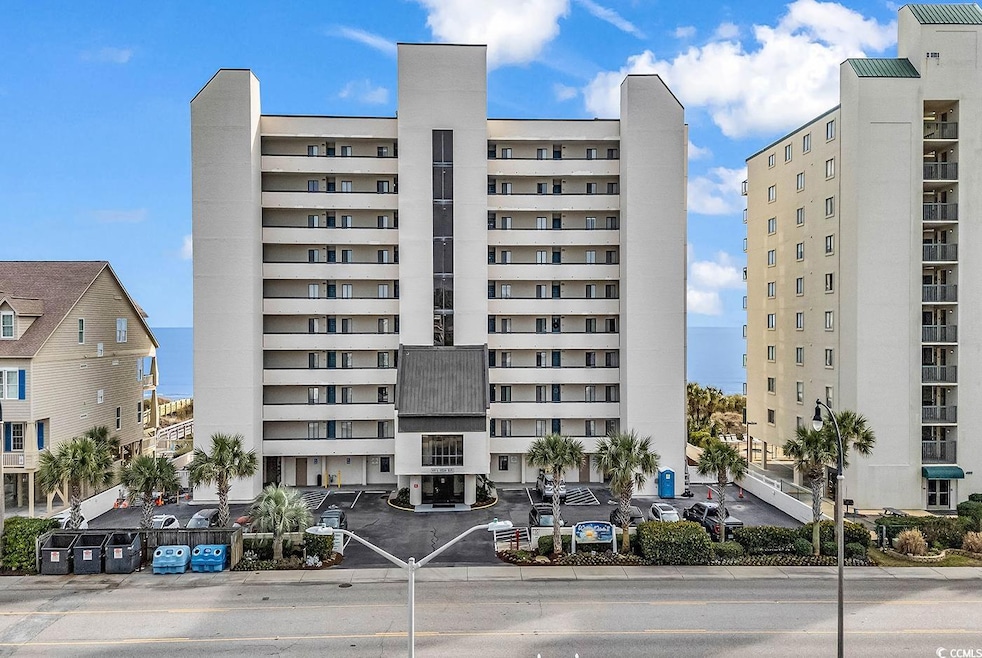 View of apartment building / complex with a water view