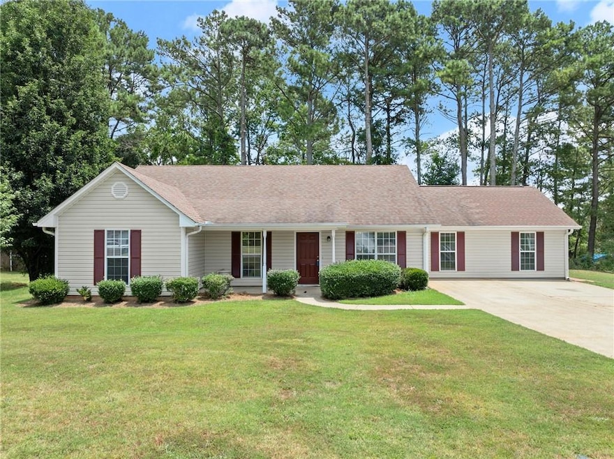 Ranch-style home with a front lawn