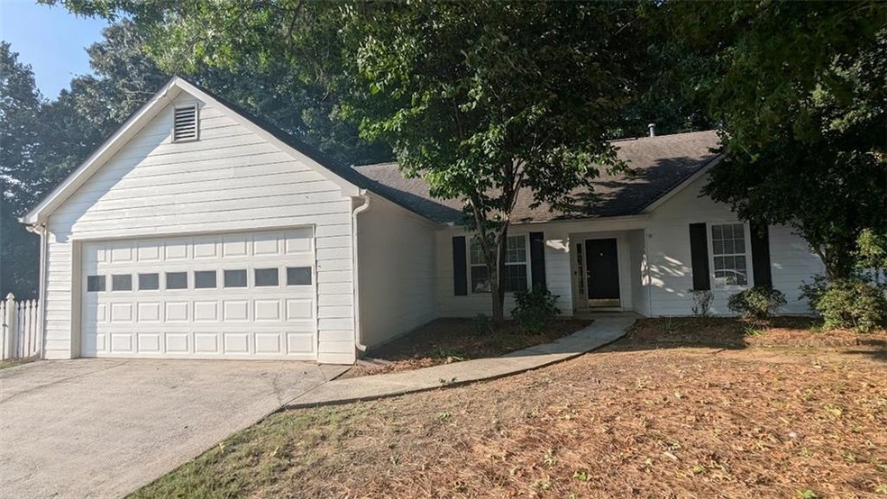 Single story home featuring a garage