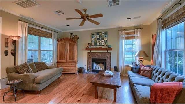 Main living area with custom mantel and blinds.